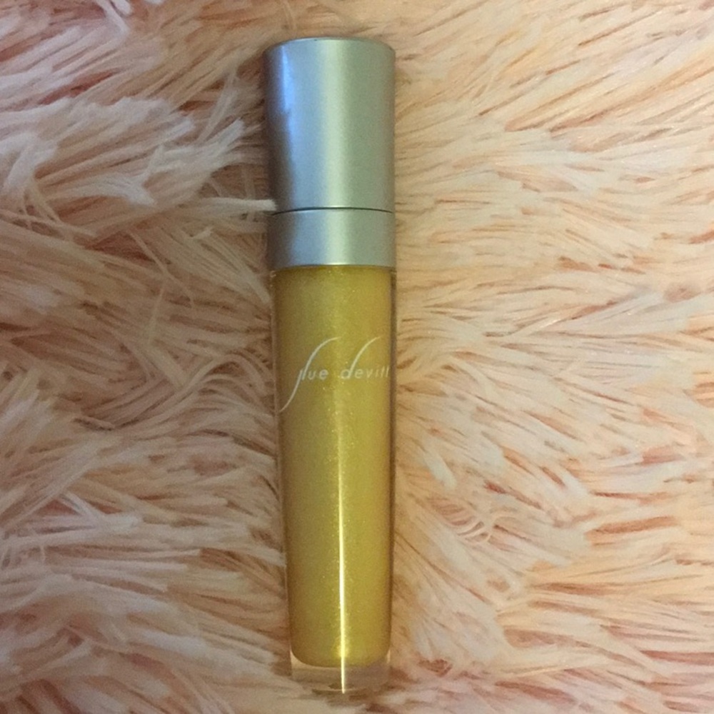 Gold glass lip gloss like new by Sue Devitt
